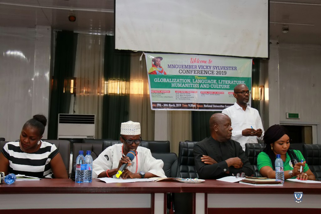 Mr. Paul-Maeyor Ihionu (second left), a staff of FUL in a plenary session, presenting a paper entitled “Globalization and Preservation of Nigerian Languages and Culture”